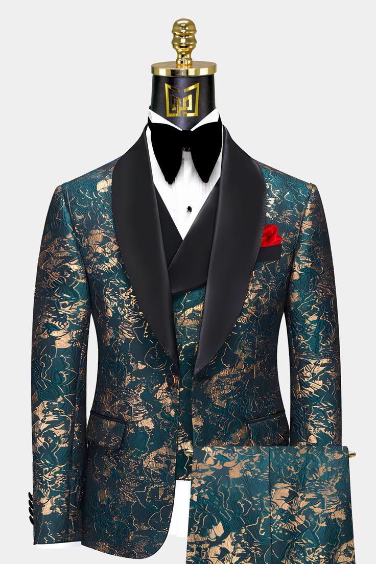 The Gentleman's Guru Abstract Teal and Gold Tuxedo is a timeless and sophisticated piece for the modern man. This 3-piece set features a slim fit cut that provides a flattering and comfortable fit, perfect for making a stylish statement at any formal event. With the custom size option, you can tailor the suit to your specific body type for an effortless and confident look. The exotic abstract pattern in teal and gold is sure to make you stand out in a crowd, adding a touch of personality to your Teal Suit, Gold Tuxedo, Tuxedo Prom, Green Tuxedo, Gold Suit, Prom Tuxedo, Classy Suits, Party Suits, Tuxedo Wedding