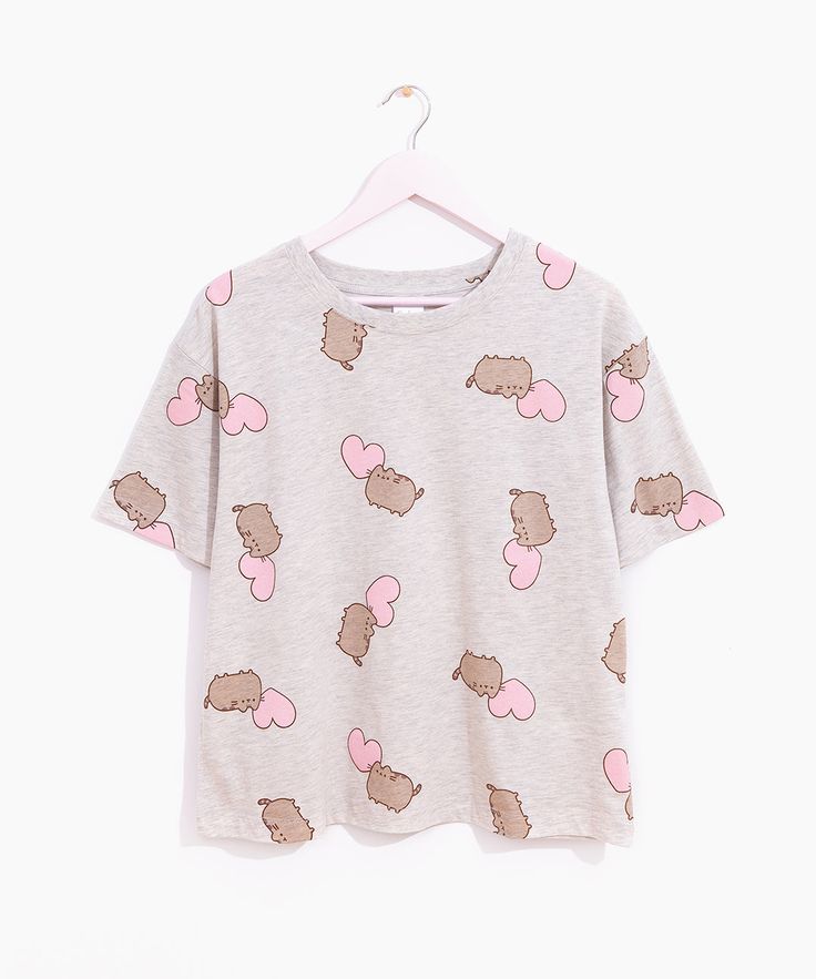 Click to see size chart How sweet! This Pusheen Shop Exclusive Pajama Set features a short-sleeve Ladies tee paired with comfortable lounge shorts. The heather gray pajama top and bottoms feature an all over pattern of Pusheen accompanied by a pink heart. Ladies pajama top features a relaxed fit with dropped shoulders Pajama shorts have side pockets and a covered elasticized waistband for a perfect fit. Ladies fit and sizing. Content: 100% Cotton. Care Instructions: Machine wash cold with like c Pusheen Shop, Comfortable Lounge, All Over Pattern, Unisex Accessories, Lounge Shorts, Pusheen, Pajama Top, Low Iron, Pajama Shorts