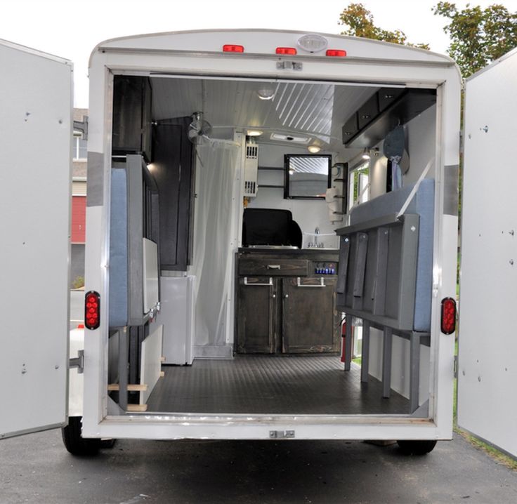 the inside of a trailer with its door open