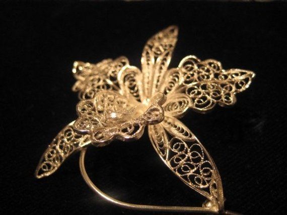 Brooch in silver filigree with goldplated center, handmaded in Italy, weight: 8 gr lenght: approximately 6 cm All items are handmade and personally designed. Custom orders are welcome! Elegant Gold Brooches For Celebration, Gold Sterling Silver Brooches For Wedding, Gold Filigree Ornate Brooches, Gold Filigree Brooches As Gifts, Ornate Gold Filigree Brooches, Gold Sterling Silver Brooches For Anniversary, Gold Sterling Silver Brooch For Anniversary, Pendant Brooches Hallmarked For Gift, Formal Filigree Pendant Brooch