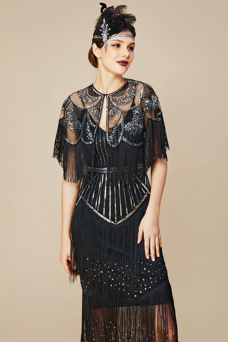 This vintage-inspired retro style dress caters perfectly to 1920s fashion. It's the incarnation of elegance and flair. With fringes swaying with your every movement, it can be deemed as truly flapper. Features: V-neck design Flapper fringe columns Complimentary cape Dazzling sequins 100% Polyester fabric Note: This dress comes with an unique size chart. Be sure to select your ideal fit from the chart before making your purchase. Fitted Beaded Fringe Flapper Dress For Costume Party, 1920s Style Fitted Dress With Beaded Fringe, Fitted Flapper Dress With Beaded Fringe For Costume Party, Flapper Dress With Beaded Fringe For Night Out, Night Out Flapper Dress With Beaded Fringe, Cocktail Flapper Dress With Fringe, Gatsby Style Flapper Dress For Party Season, Fitted Flapper Dress With Beaded Fringe, Gatsby Style Beaded Fringe Flapper Dress For Evening