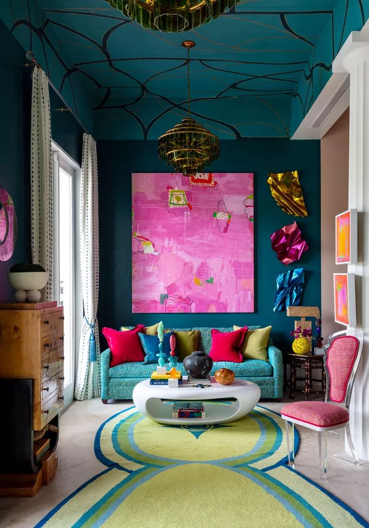 a living room filled with colorful furniture and art