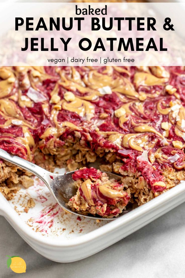 baked peanut butter and jelly oatmeal in a baking dish with a spoon