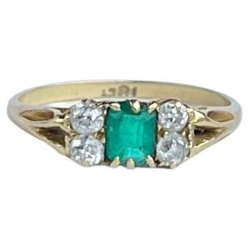 The central emerald is so bright and beautiful and measures 40pts. Sat either side it are pairs of bright shimmering old mine cut diamonds each measuring 7pts. The ring is modelled in 18ct gold. Ring Size: L 1/2 or 6 Height Off Finger: 3mm Weight: 2.3g Art Deco Emerald, Bright And Beautiful, Three Stone Rings, Emerald Diamond, Three Stone, Gold Ring, Diamond Cuts, Gold Rings, Emerald