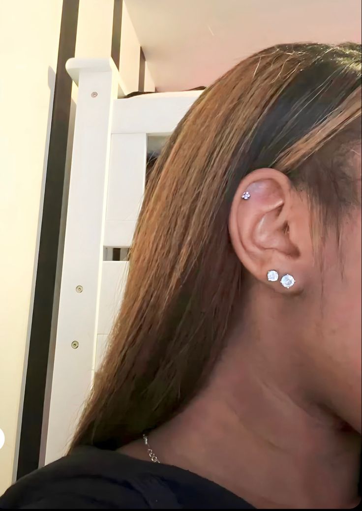 a woman with ear piercings on her ears