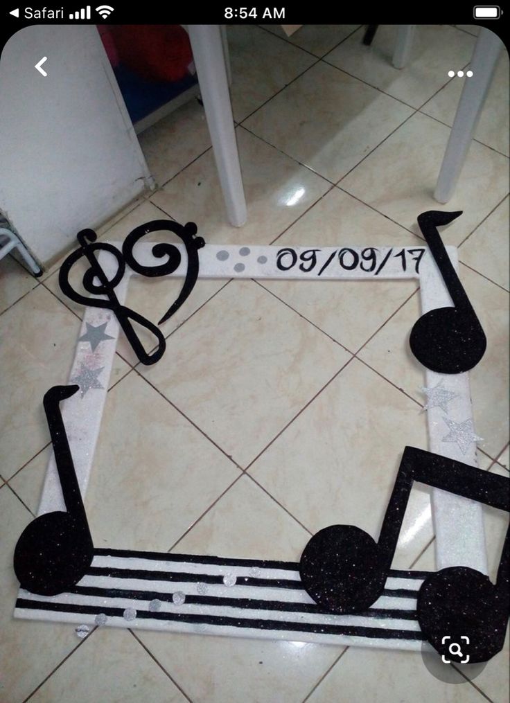 music notes are arranged in the shape of a treble strip with musical notes painted on it