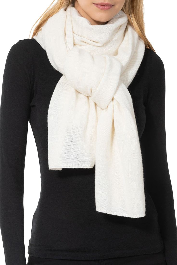 Snuggle up in style with this luxurious cashmere wrap that is perfect for cold days. Both fashionable and functional, this classic, versatile cashmere wrap can be worn as a shawl, scarf, or cover up. Available in a wide assortment of colors, dress it up or dress it down and stay cozy and comfortable year-round. 26" x 78" Rectangle scarf Cashmere knit construction 100% cashmere Dry clean Imported Model stats: 5'10", 32" bust, 25" waist, 36" hip. Model is wearing size S. Cashmere Travel Wrap, Colors Dress, Travel Wrap, Ways To Wear A Scarf, Cashmere Fabric, Cashmere Wrap, Weather Wear, Wrap Scarf, Swimwear Cover Ups