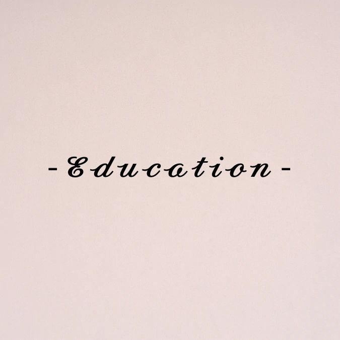 the word education written in cursive writing on a white paper with black ink