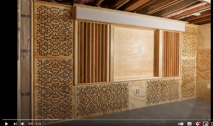 an unfinished room with wooden slats on the walls