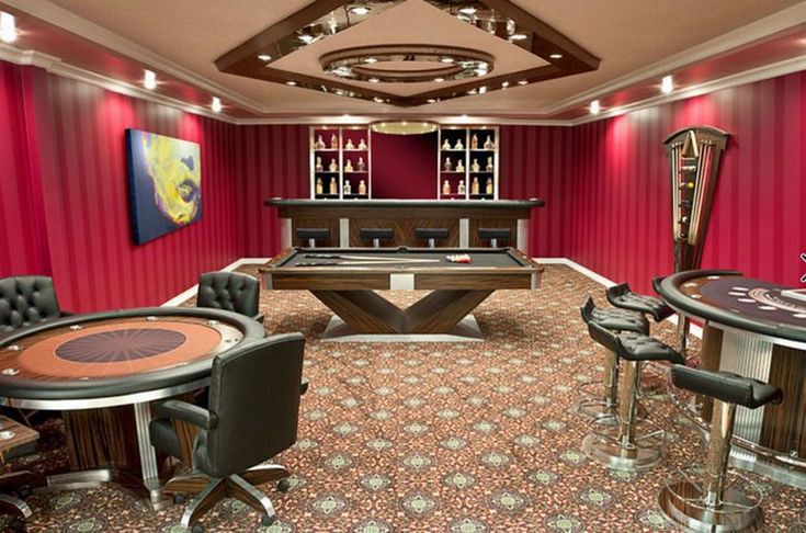 a room that has some tables and chairs around it in front of a pool table