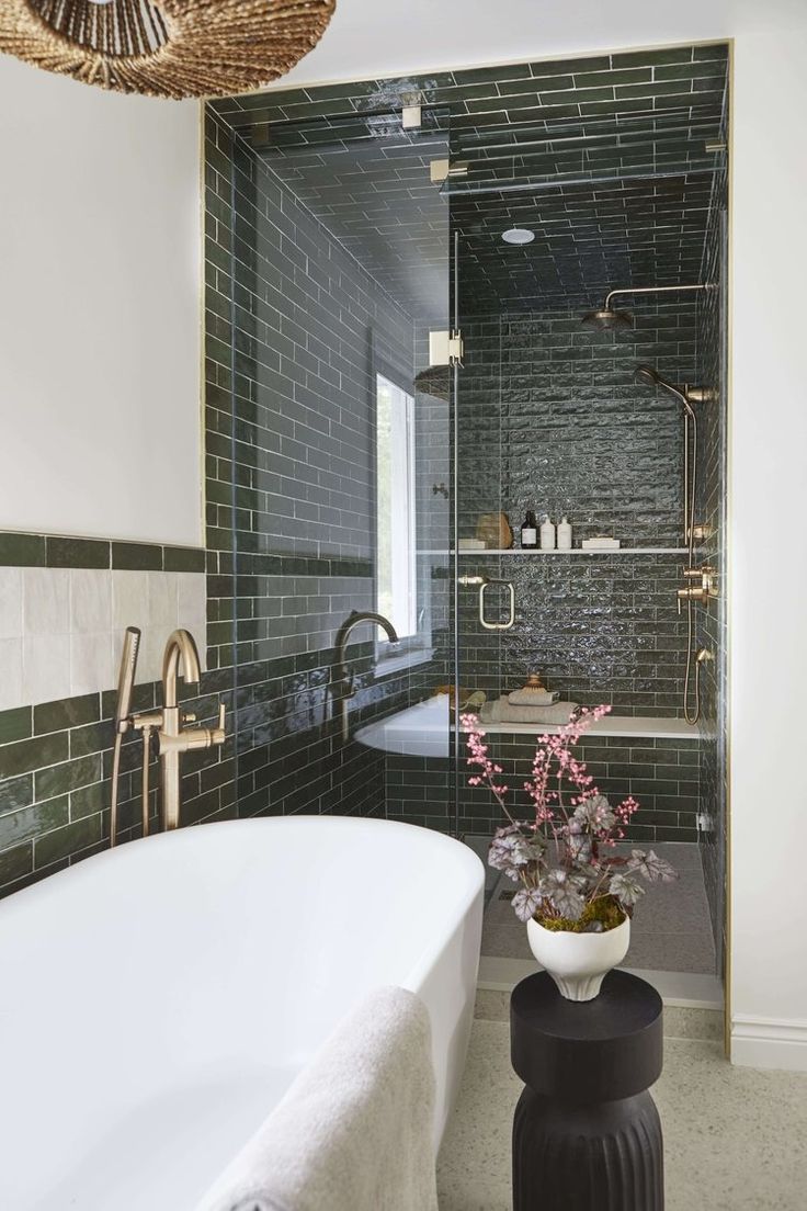 a bath room with a tub a sink and a mirror on the wall in it