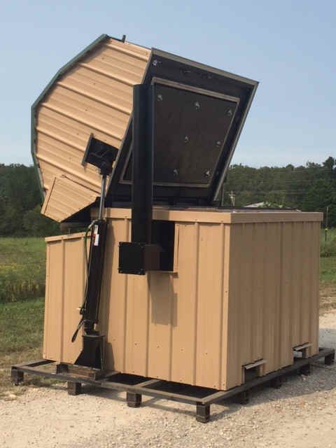 an outhouse on wheels with the roof open