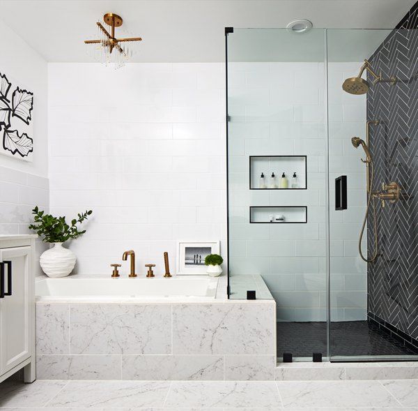 a bathroom with marble floors and white walls