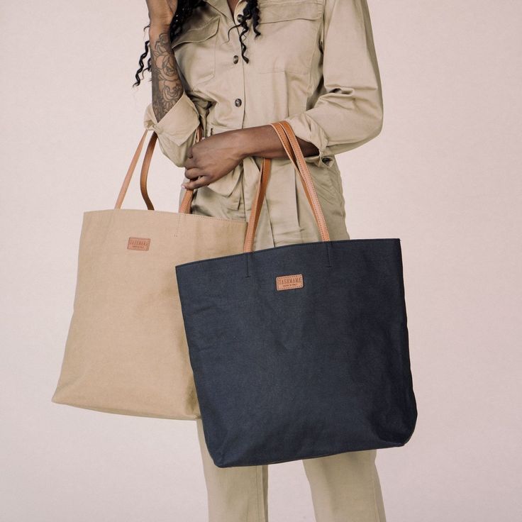 Designed to take you everywhere, meet the must-have, double-handled tote bag that you'll reach for season after season. With a generously spacious interior, this bag is your go-to for work, play, kids and travel and will keep you looking chic and put together. Lightweight and sustainably made, you won't want to leave home without it. Everyday Cotton Shoulder Bag With Top Handle, Canvas Shopping Bag With Double Handle, Everyday Cotton Top Handle Shoulder Bag, Canvas Shopping Bags With Double Handle, Canvas Double Handle Shopping Bag, Large Capacity Tote Travel Bag For Daily Use, Beige Canvas Bag With Reinforced Handles For Travel, Beige Shoulder Bag With Reinforced Handles, Everyday Leather-handled Tote Travel Bag