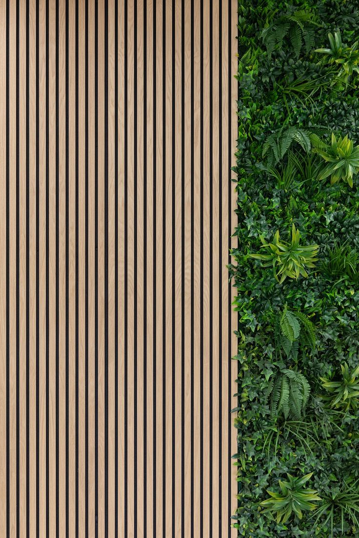 an overhead view of a green wall with vertical striped lines on it and a bench in the foreground