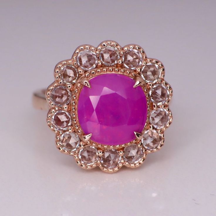 This ring features my Edwardian design with 1 piece of silky unheated vivid pink sapphire and 14 pieces of round rose cut colorless sapphires. The size is in US 5 and made of solid 14K gold can be sized up or down for $65 if needed. This item is brand new and one of a kind designed by me. The certificate will be included and describes the sapphire as follows: Shape And Cut: Cushion Brilliant Weight: 2.7ct Species: Natural Sapphire Unheated Colour: Vivid Pink Transparency: Transparent Luster: Heirloom Pink Sapphire Round Ring, Pink Sapphire Ring With Rose Cut Diamonds, Pink Sapphire Jewelry With Rose Cut Diamonds, Luxury Pink Sapphire Ring With Rose Cut Diamonds, Elegant Pink Sapphire Rose Cut Diamond Rings, Purple Engagement Rings, Sapphire Halo Ring, Pink Spinel, Special Ring