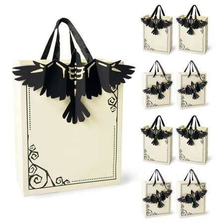 black and white paper bags with birds on the handles are shown in front of each other