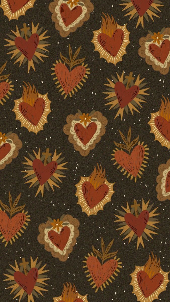 an abstract pattern with hearts and sunbursts on a black background that looks like it has been made out of fabric