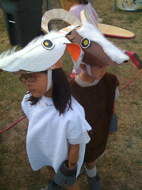 two children in animal costumes standing next to each other