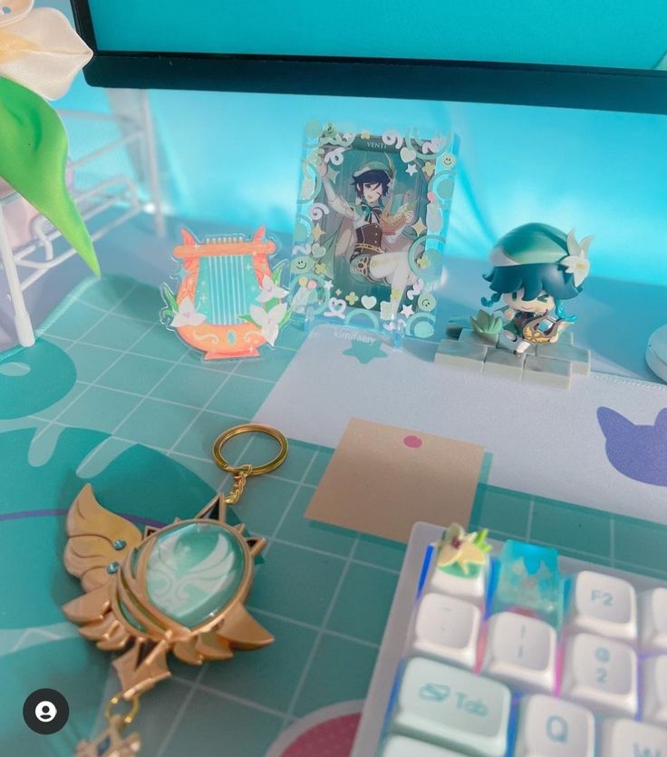 a keychain with an anime character on it and some other items sitting next to it