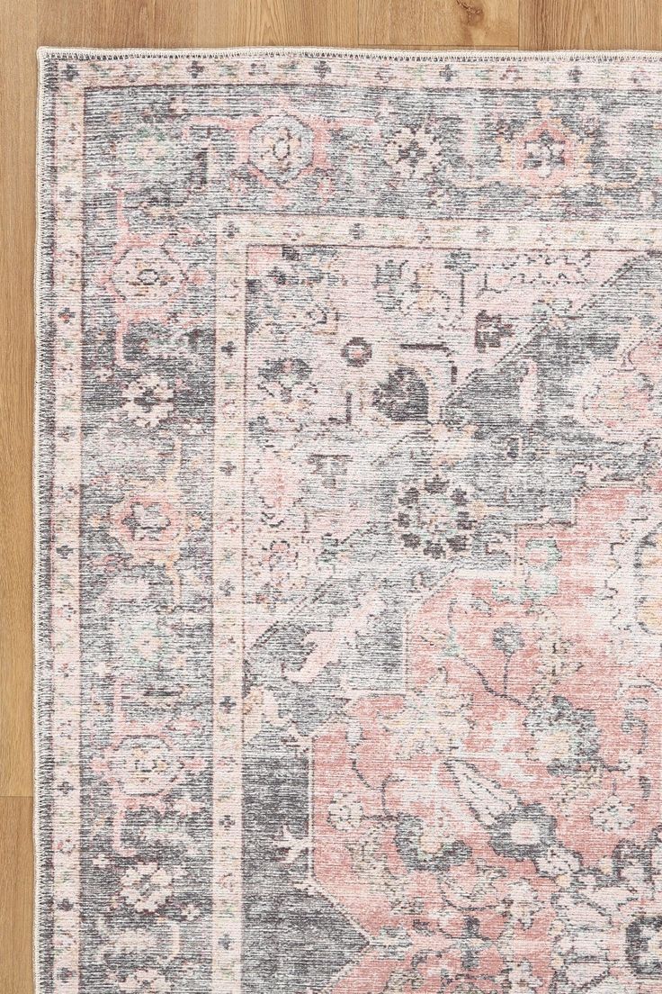 Add a touch of vintage charm to your space with Hugo! This area rug has a unique design, inspired by original vintage rugs from Turkey. The faded colors and grey border work well with its floral motifs. Featuring faded pink, gray, and light blue tones giving it an unmistakable boho charm, adding warmth to any space.Mad Pink And Grey Rug, Pink Boho Rug, Girls Room Rugs, Basement Room, Basement Renovation, Faded Colors, Grey Couches, Muddy Paws, Teal And Grey