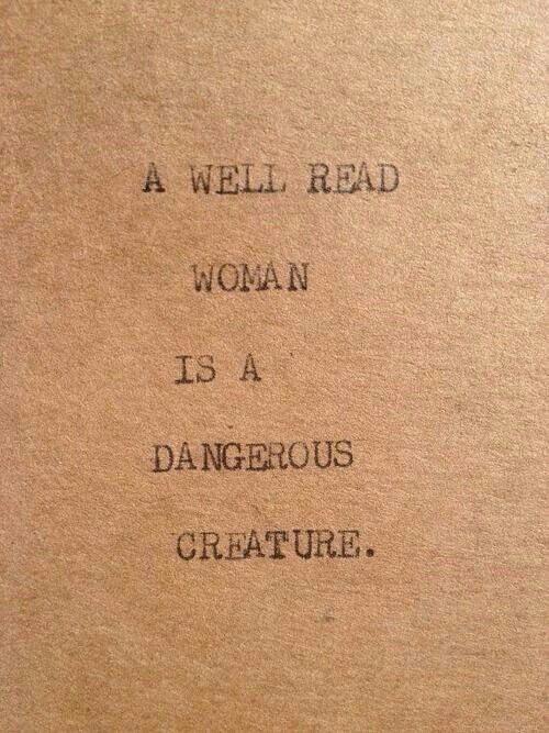 a well read woman is a dangerous creature written on a piece of brown paper with black ink