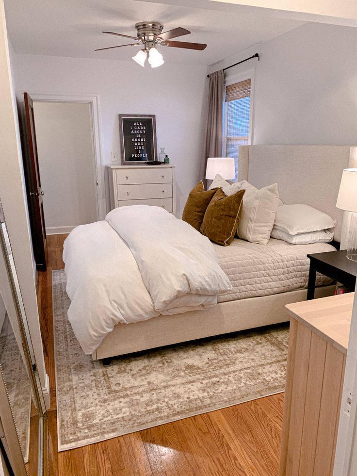 a bed sitting in the middle of a bedroom next to a doorway