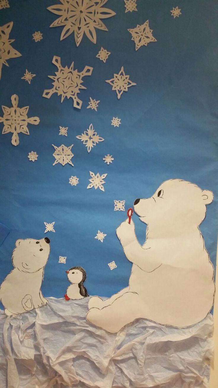 a polar bear and two penguins are sitting on the snow covered ground with snowflakes