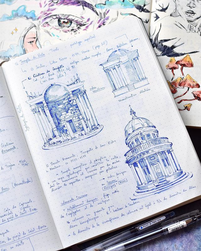 an open notebook with drawings on it