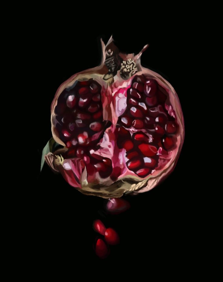 a pomegranate is shown in the dark with its top half open and some leaves on it