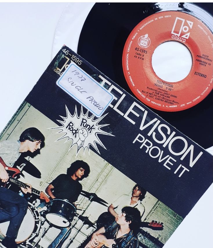 an album cover with the band elvisson on it next to a record player's drum kit