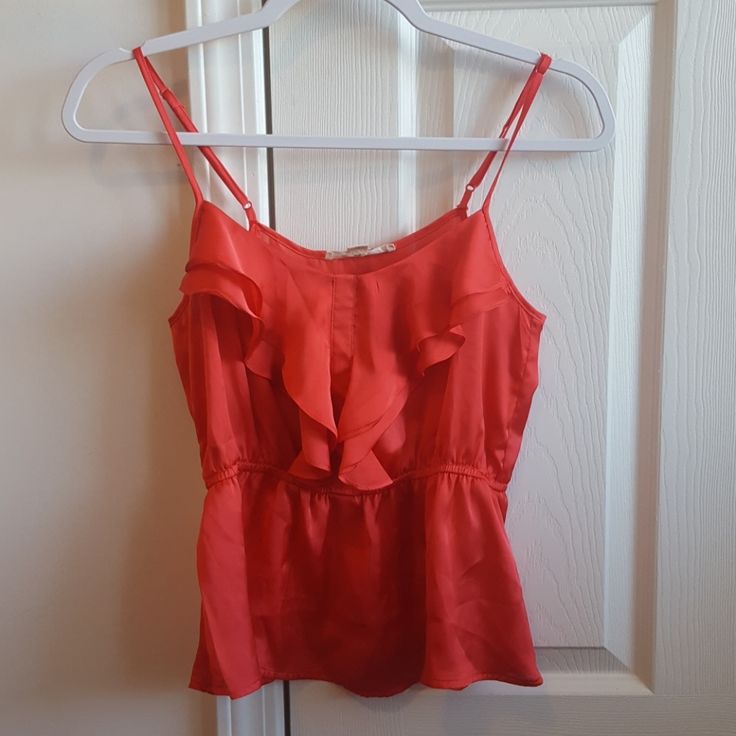 A Coral Color Tank Top With A Cinched Waist And Ruffle Front Detailing. Has Adjustable Straps. Has A Very Nice Fit, Hits Right At Waist. Silky Material. Can Be Dressed Up Or Down Nicely. Never Worn. Is A Little Wrinkled, Just Need To Be Washed. Size S But Fits More Like An Xs. Sleeveless Tops For Date Night From Forever 21, Summer Ruffle Tops For Night Out, Summer Tops With Ruffles For Night Out, Casual Ruffled Top For Date Night, Casual Ruffles Top For Date Night, Ruffled Spaghetti Strap Top For Night Out, Summer Ruffled Tops For Night Out, Flirty Camisole Top With Ruffles, Casual Ruffled Camisole Blouse