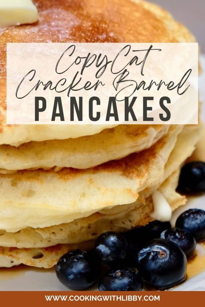 pancakes topped with blueberries and butter on top of a white plate that says copycat cracker barrel pancakes