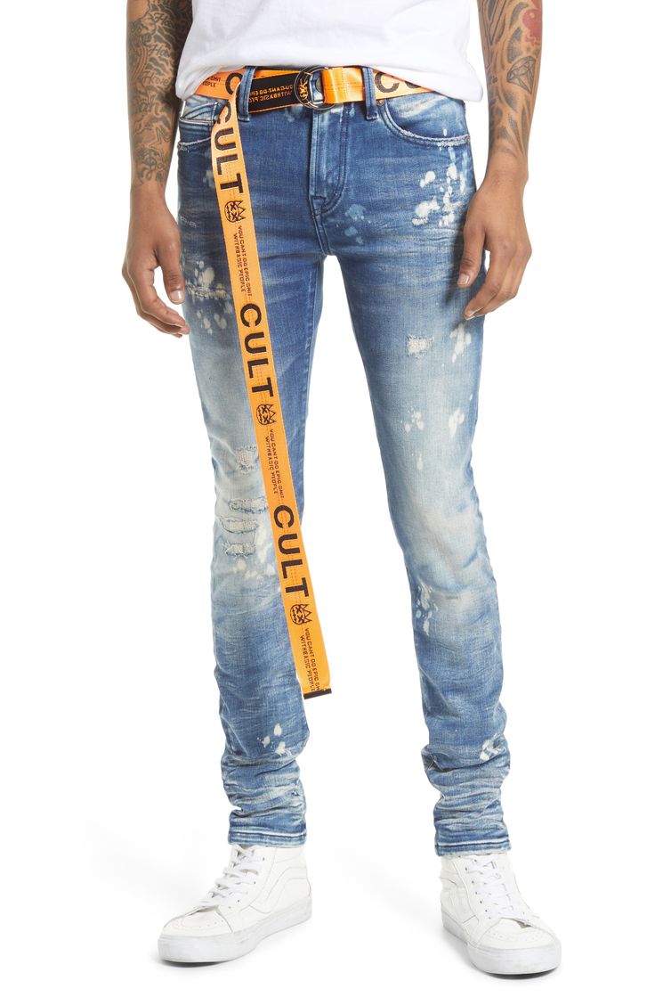 These super-skinny stretch-denim jeans are given a punk-rock update with a bleached wash covered in rips and paint splatters. A branded utility belt adds to the grunge aesthetic. 32" inseam; 11 1/2" leg opening; 10 1/2" front rise Zip fly with button closure Five-pocket style Removable utility belt 86% cotton, 10% spandex, 4% polyester Machine wash, line dry Imported Men's Clothing Urban Style Distressed Fitted Jeans, Urban Distressed Fitted Jeans, Ripped Fitted Punk Jeans, Punk Ripped Fitted Jeans, Punk Style Ripped Fitted Jeans, Fitted Ripped Punk Jeans, Fitted Punk Jeans With Five Pockets, Punk Style Fitted Jeans With Five Pockets, Fitted Punk Style Jeans With Five Pockets