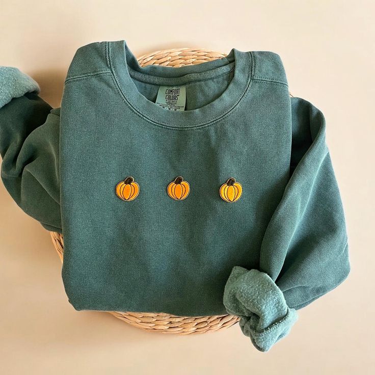 Cozy up with our Comfort Colors Pumpkin Crewneck Sweatshirt this fall season! This makes the perfect sweatshirt to lounge this fall and halloween season.  - Our sweatshirt material is super soft and high quality! ♡ - Garment-Dyed Sweatshirt (Sustainable style)  - 80% cotton, 20% polyester - All our sweatshirts run a UNISEX fit. (Both for men and women) They fit true to size. But if you like a more baggy look, we highly recommend sizing up. - These letters are embroidered iron-on patches that have been heat pressed, not embroidered. Rest assured, they'll be fully in tact after wash.  Please be mindful that we do not accept RETURNS / EXCHANGE / ORDER CANCELLATIONS in any way because this is made to order. We are also open for wholesale/bulk orders, kindly send us a message! Handmade in Chica Cotton Sweater For Fall, Green Cotton Sweater For Fall, Green Casual Sweats For Fall, Casual Green Sweats For Fall, Cozy Green Sweats For Fall, Green Fall Hoodie For Loungewear, Cozy Crew Neck Sweats For Fall, Fall Relaxed Fit Crew Neck Sweats, Green Fall Loungewear Hoodie