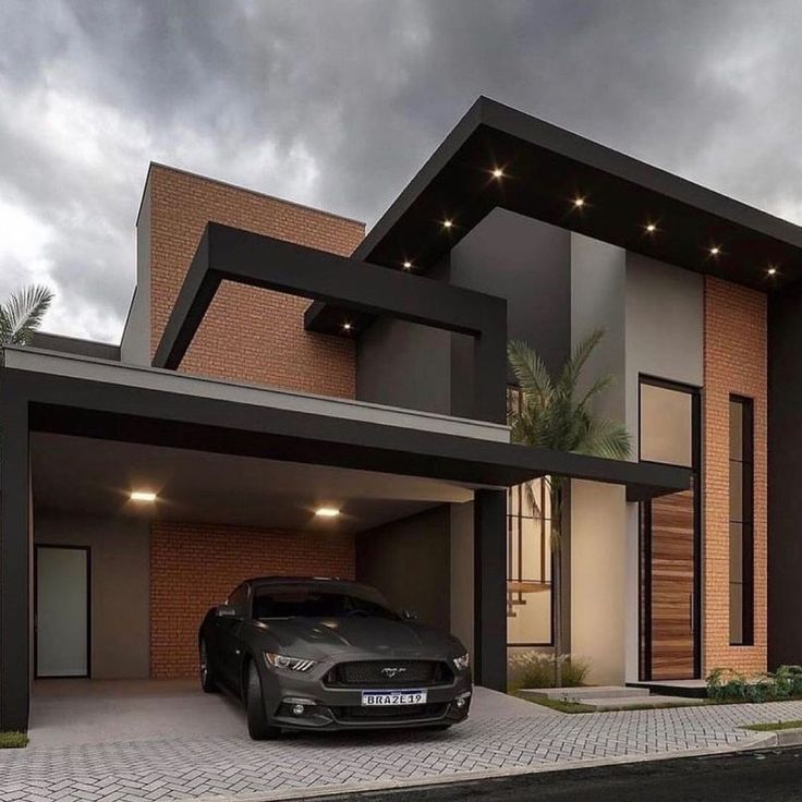 a car is parked in front of a modern house