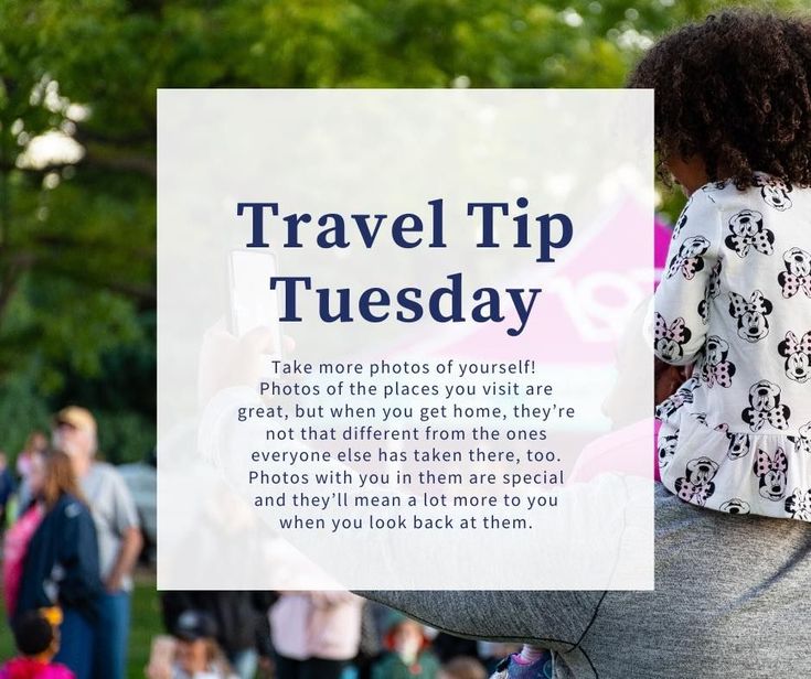 a woman holding a sign that says travel tip tuesday with people walking in the background