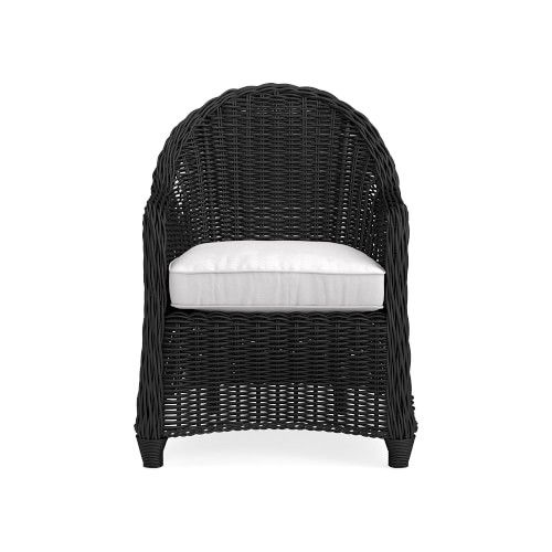 the all weather wicker chair with white cushions is shown in black and has a pillow on it