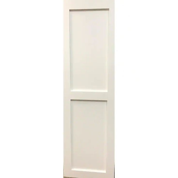 a white door on the side of a wall with no glass or doors in it