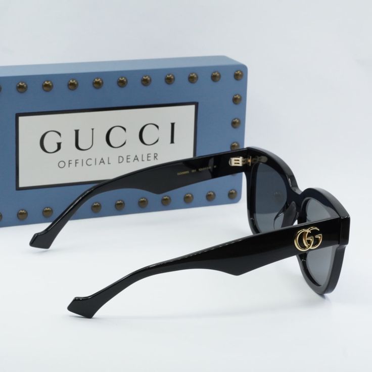 Introducing the stunning Gucci GG0998S 001 Black/Grey sunglasses, a true fashion statement for the modern woman. These stylish shades feature a sleek black acetate frame with a bold square shape, adding a touch of sophistication to any outfit. The grey lenses offer a chic contrast to the black frame, creating a timeless and classic look that is sure to turn heads wherever you go. At OSSA FRAMES, we pride ourselves on offering only the highest quality designer eyewear, and these Gucci sunglasses Gucci Acetate Wayfarer Sunglasses, Gucci Wayfarer Acetate Sunglasses, Trendy Gucci Cat Eye Sunglasses With Polarized Lenses, Gucci Designer Cat Eye Sunglasses With Uv Protection, Designer Gucci Cat Eye Sunglasses With Uv Protection, Gucci Designer Cat Eye Sunglasses With Mirrored Lenses, Gucci Luxury Cat Eye Polarized Sunglasses, Designer Gucci Cat Eye Sunglasses With Mirrored Lenses, Gucci Luxury Cat Eye Sunglasses With Polarized Lenses