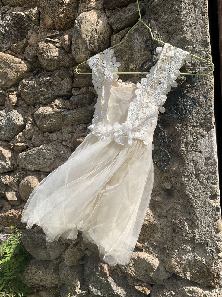 "Such a nice little little dancingdress, tutu, made from old materials. Old tulle, old lace and flowers with \" pearls\" With zipper. Double tulle. Good condition For a little girl 2,3 years Lenght: 60 cm From underarm to the other:25 cm Is also nice hanging on the wall,door Shipping costs in Europe: 13-18 euro Ask me please" Garden Party Tulle Dress With Lace Patchwork, Lace Princess Dress With Floral Applique For Baptism, Cream Princess Dress With Lace Trim For Party, White Lace Tutu Dress With Lace Trim, Cream Tulle Skirt Tutu Dress For Baptism, Summer Princess Dress With Lace Trim, White Tutu Dress With Lace Trim For Parties, Summer Lace Princess Dress With Lace Trim, Spring Wedding Tutu Dress With Lace Patchwork