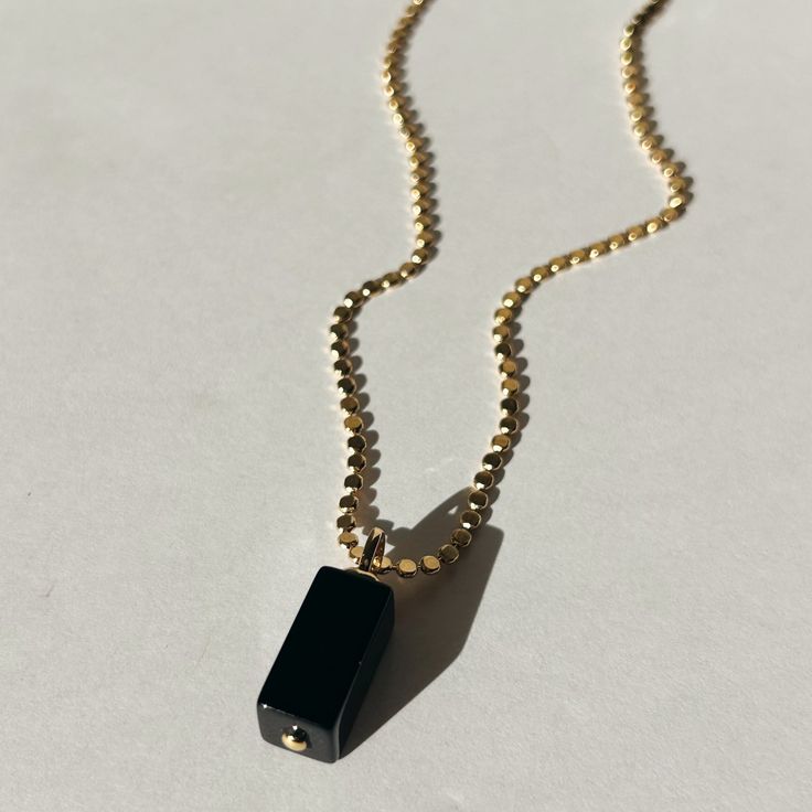 Introducing the Elixir Necklace - this one is for the minimalist girly. She's sophisticated & will add value to your personal style. Some believe that the Onyx stones are associated with love, protection & courage. Others believe that black onyx stones are used to create balance & harmony in the wearer's life. The Elixir Necklace will make you magnetic! Product Details: 18" 14K Gold-Filled Flat Ball Chain 24mm Black Onyx Charm Water-Wearable Made in Scottsdale, AZ Black Onyx Stone, Solid Gold Jewelry, Scottsdale Az, Onyx Stone, Gold Filled Jewelry, Ball Chain, The Minimalist, Black Onyx, Jewelry Care