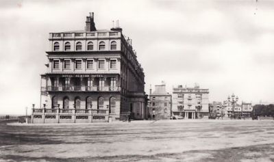 an old black and white photo of buildings