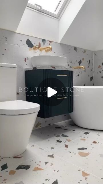 a bathroom with a skylight, toilet and bathtub in the middle of it