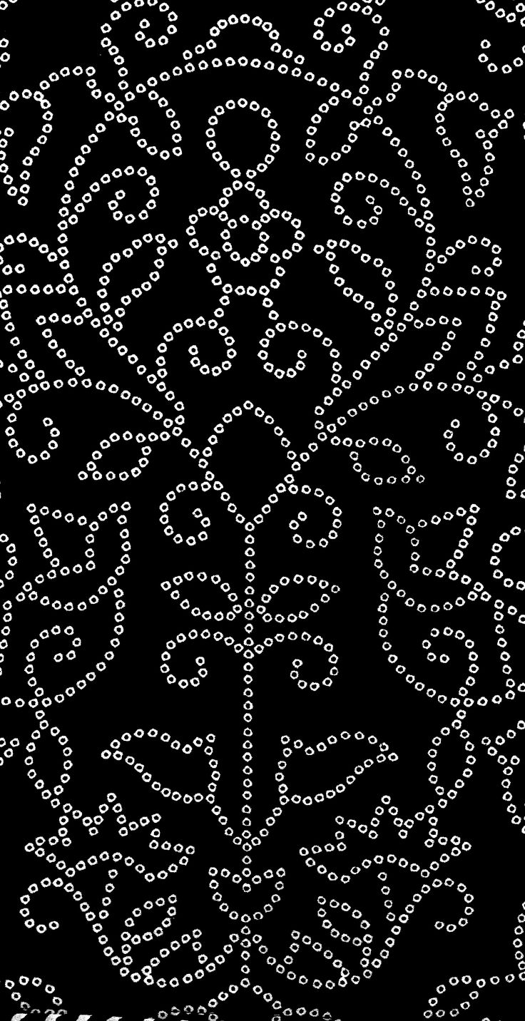 a black background with white circles and dots in the shape of an ornament