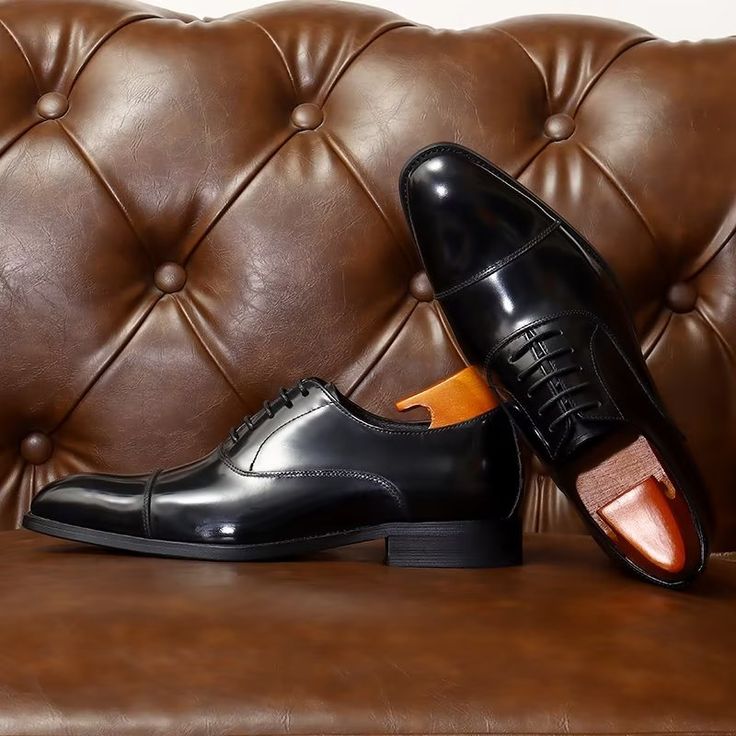 Introducing our exquisite Luxury Leather Round Toe Oxford Dress Shoes, crafted with the finest quality genuine cow leather for a timeless appeal. Not only do they exude luxury and style, but they also provide utmost comfort with their genuine leather lining and pigskin lining material. Elevate your style and make a lasting impression with these versatile and sophisticated shoes. Invest in the perfect blend of style, comfort, and durability today. Leather Lace-up Closed Toe Shoes For Business, Fitted Leather Lace-up Shoes, Timeless Style, Timeless Fitted Leather Lace-up Shoes, Fitted Closed Toe Leather Shoes With Leather Lining, Fitted Leather Shoes With Closed Toe, Fitted Leather Oxfords With Closed Toe, Brown Patent Leather Business Shoes, Business Leather Shoes With Closed Toe, Business Oxford Dress Shoes With Closed Toe