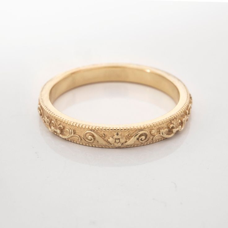 This vintage-inspired ring is inspired by the Italian Baroque style. Handmade and polished, it is available 8K or 14K gold and has a uniquely vintage vibe about it. This ring is designed in 3D and not made out of wire or soldered but cast directly in your size so there are no solder marks on the ring whatsoever. Customization: This band is fully customizable with any text you would like on the inside, at no extra cost. It can also be made in any size, too! Please message me for quarter sizes. Ma Heirloom Style Formal Filigree Ring With Decorative Band, Heirloom Ring With Intricate Round Band Design, Heirloom Ring With Intricate Design, Gold Milgrain Rings For Formal Occasions, Elegant Ceremonial Ring With Decorative Band, Vintage 14k Gold Engraved Ring With Intricate Design, Heirloom 14k Gold Ring With Classic Design, Heirloom Yellow Gold Rings With Classic Design, Classic Heirloom 14k Gold Rings