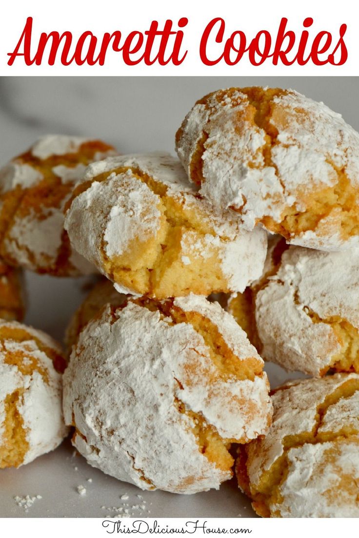 a pile of powdered sugar covered cookies sitting on top of a white countertop