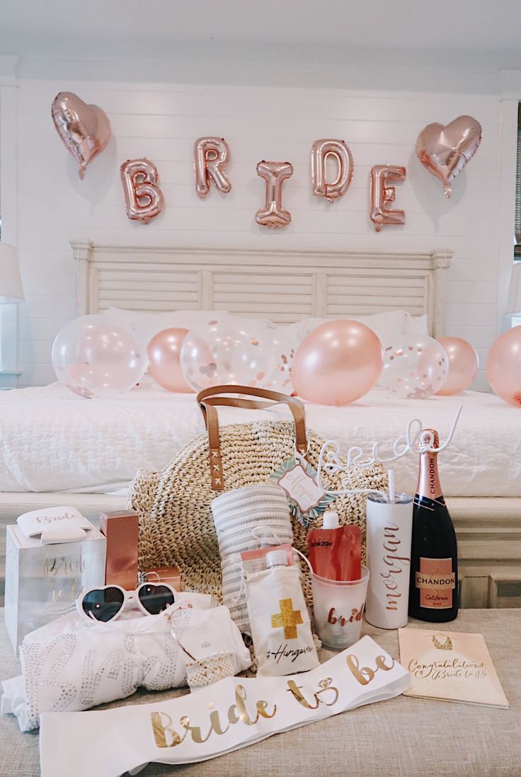 the bridal party is set up with champagne and confetti on the bed