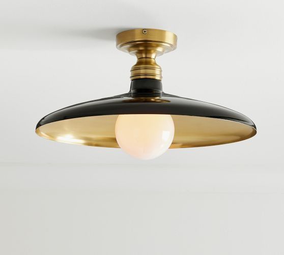 a black and gold ceiling light hanging from the ceiling